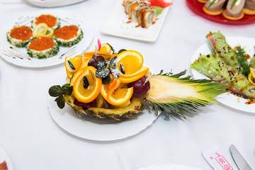  Fruit sliced apples, oranges and pineapple, garnished with mint and powdered sugar