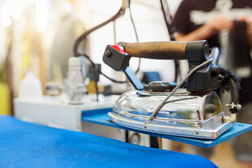 Close up of professional iron in a tailor's factory