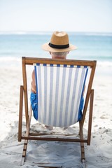 Mature man relaxing on a deck chair