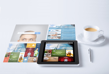 tablet pc with news application and coffee cup