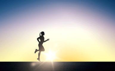 happy young sports woman running outdoors