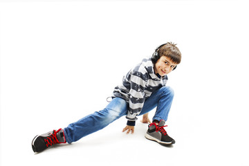 
Young man with ear-phones dancing hip-hop. Isolated on white background
