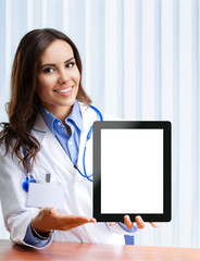 Doctor showing blank tablet pc for copyspace