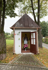 Fototapeta na wymiar Old Wayside shrine in Podstlice near Cracow. Poland
