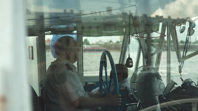 Ship Captain Steering His Ship