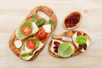 Sandwiches with mascarpone, dried tomatoes, basil