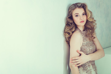 Beautiful bride in wedding dress. Portrait of young bride. Studio shot.
