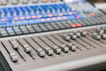 Obraz na płótnie Canvas Sound mixer with many buttons with side light
