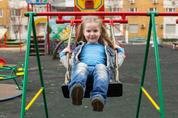 Girl swinging.