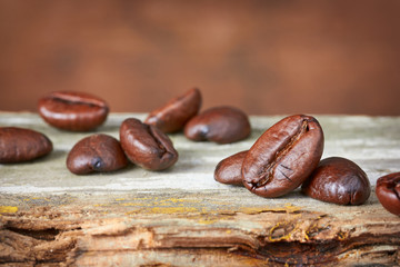 Coffee beans on wood background. Close-up