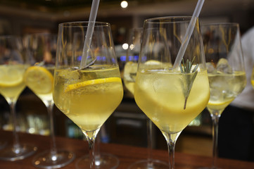 Closeup of glasses of cocktails in a row on a table