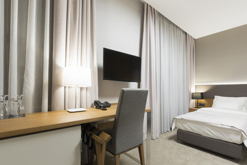 Luxury hotel bedroom in the evening