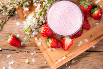 Fresh milk, strawberry,drink on wooden table, assorted protein cocktail with fresh fruits.