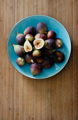 Fresh California figs on a blue plate