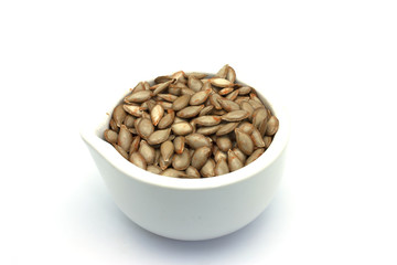 Cucurbita Moschata Fresh Seeds in White Mortar and Pestle