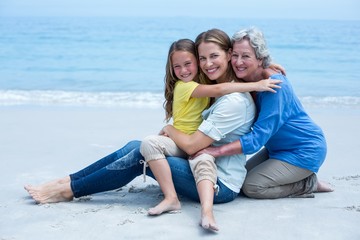 Fototapeta na wymiar Cheerful multi-generation family relaxing at sea shore