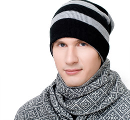 Young man in scarf and hat