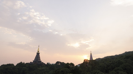 view of asian buddhist pagoda during sunset