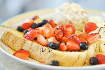 French toast with strawberry ,blueberry and ice cream