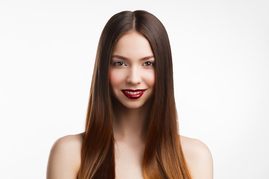 Beauty portrait of young brunette woman  with red lips on white