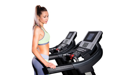 Fototapeta na wymiar Fitness woman running on treadmill in gym