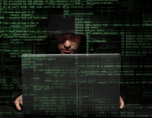 hacker at work with graphic user interface around