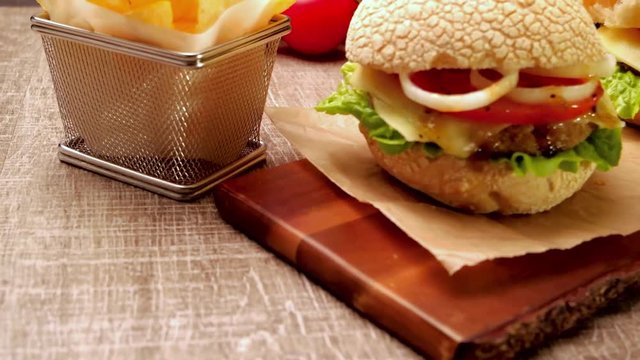 Homemade veggie burger served on wooden table.