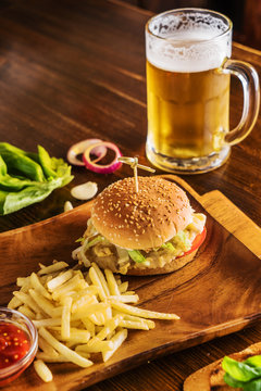 burger with fries and a cold beer