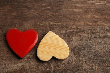 Wooden hearts on rustic wooden background