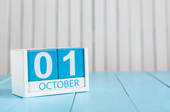 October 1st. Image of october 1 wooden color calendar on blue background. Autumn day. Empty space for text. World Vegetarian Day