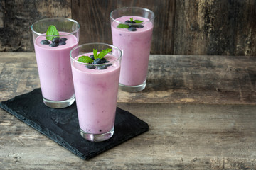 Fresh blueberry smoothie on rustic wood
