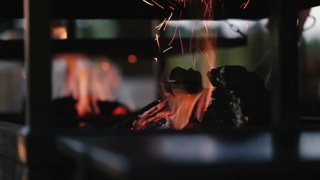 Sparks fire cracks in grill fire pit