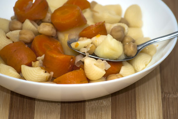 Vegetable soup with pasta, carrots and chickpeas