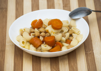 Vegetable soup with pasta, carrots and chickpeas