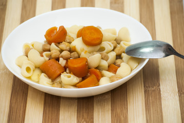 Vegetable soup with pasta, carrots and chickpeas