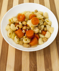 Vegetable soup with pasta, carrots and chickpeas