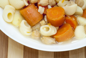 Vegetable soup with pasta, carrots and chickpeas