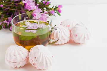 Pink zephyr on the white wooden background. Shallow depth of field.