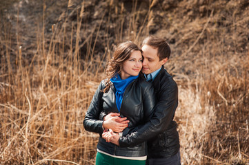  Happy couple smiling outdoors in the mountains