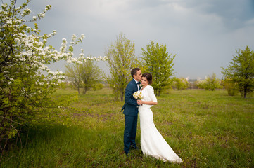 Bride and groom walking at the river