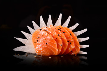 Fan out salmon sashimi slices