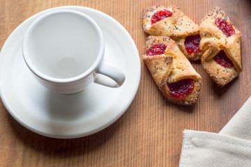 White Cup and cookies on old wooden table