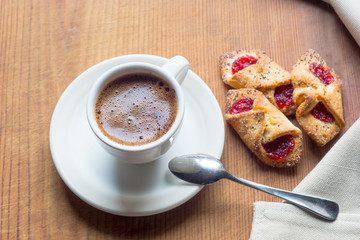 Cup of hot coffee and cookies 