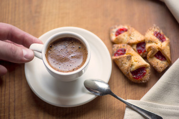 Cup of hot coffee and cookies 