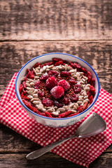 Breakfast banana smoothie bowl topped with goji berries,raspberry