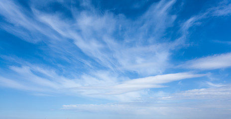 Naklejka na ściany i meble The background of blue sky with clouds