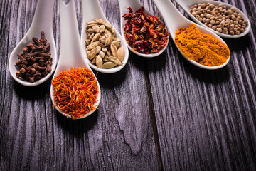 spices and herbs on wooden table , medicinal concept