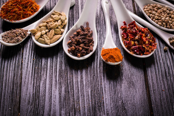 spices and herbs on wooden table , medicinal concept