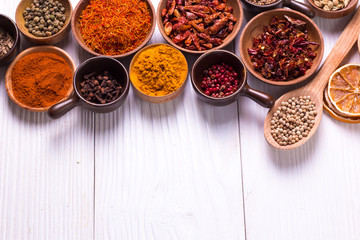 spices and herbs on wooden table.