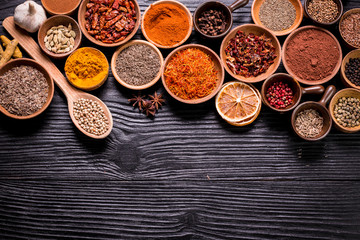 spices and herbs on wooden table.